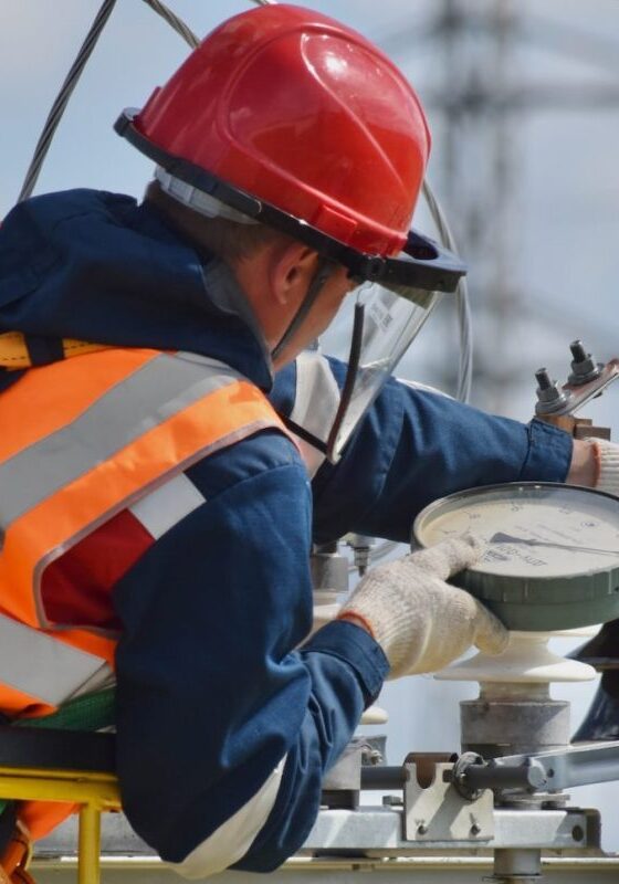 man in blue orange and white jacket wearing red helmet